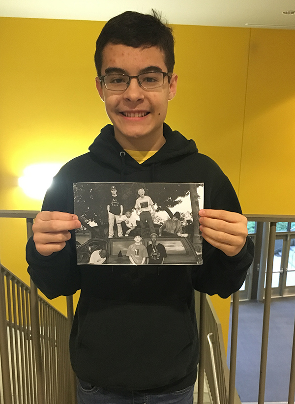 EXHIBITING ADMIRATION Freshman Braden Humphrey showing off his favorite photo of the hip hop group Brockhampton. This new up and coming boy band is like no other band. Humphrey says, “I haven’t been listening to them long. However, I can tell they are going to go far.”