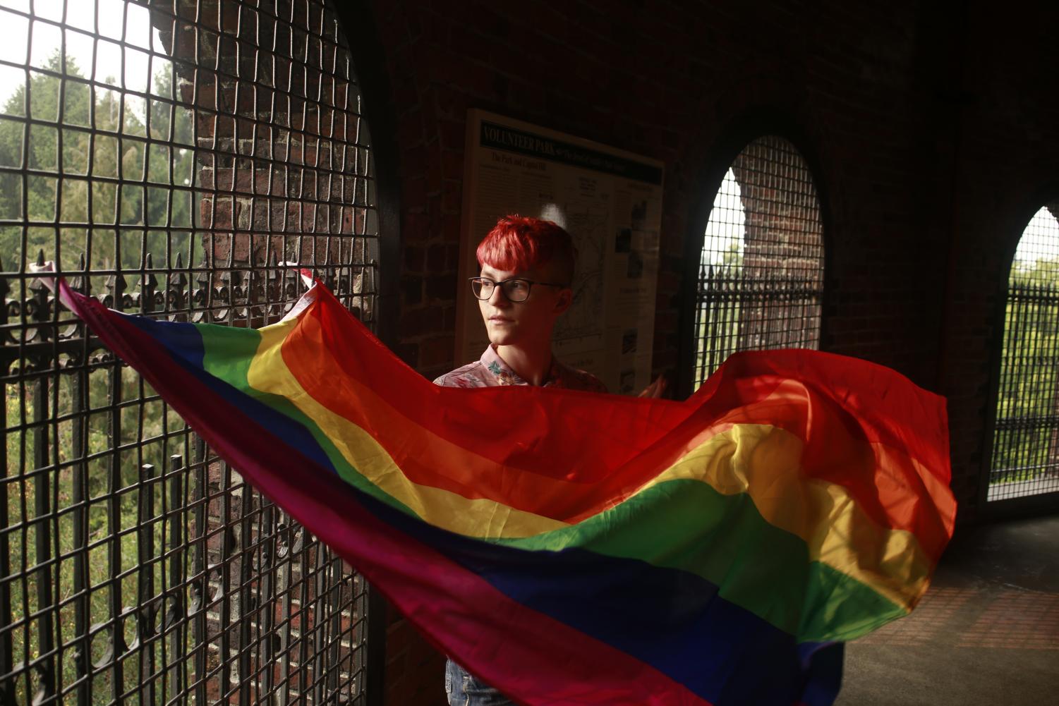 PRIDE: Senior Mimi Gaudiano displays their pride flag, which sthey plan to wear as a cape on Oct. 11 for the second year in a row. They made the decision to come out as Nonbinary this September, preferring the pronouns they and them.