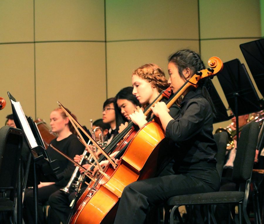 SEASON PREMIERE: Senior Hannah Chernin (fourth from left) plays cello in the Evergreen Season Premiere. She enjoyed playing the selection of music with other talented musicians. It was new for all of us as we got a new conductor this year, and she did a fantastic job bringing together a really wonderful program, said Chernin.