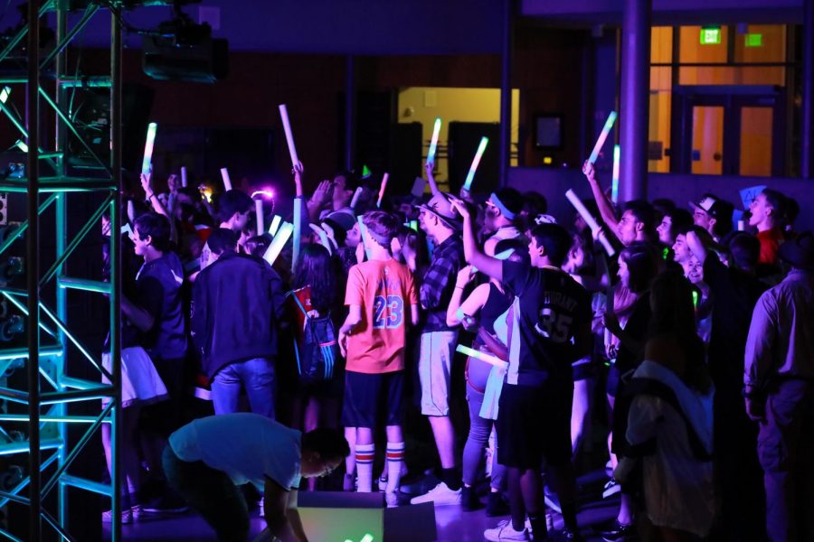 BRIGHT LIGHTS AND SMILES! This is the first school dance where we have had a giant screen to broadcast videos of us dancing back to us and it seemed like a big hit with students jumping and waving to be captured on screen. The neon lights definitely added a fun vibe to the dance that really accentuated the heavy bass.