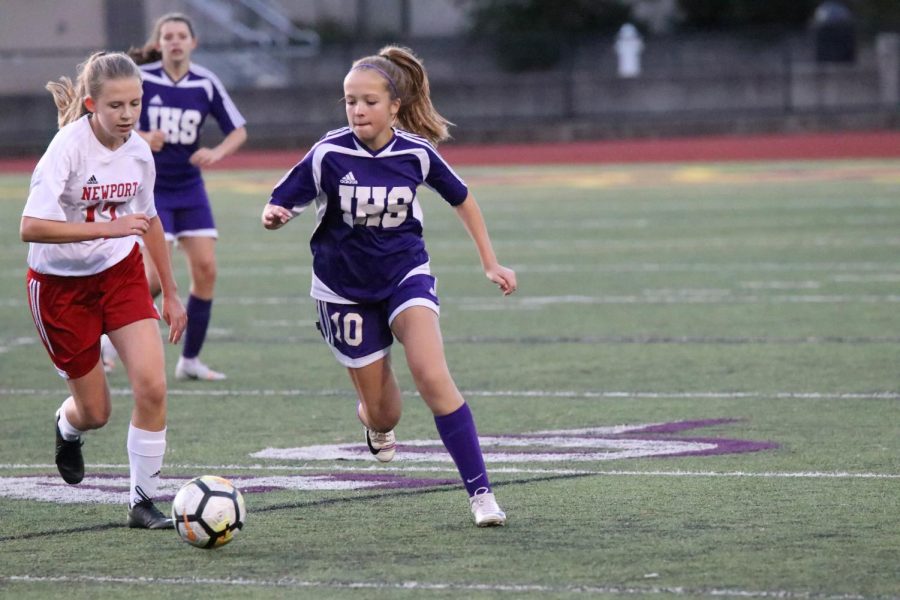 ANOTHER+KNOCK-OUT+FOR+ISSAQUAH+The+girls+varsity+soccer+team+locked+in+huddle+before+their+exhilarating+5-2+victory+versus+Newport.+
