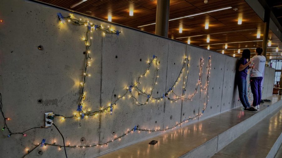 HOLIDAY SPIRIT: During “Deck the Halls,” ASB spells “Issy” with a string of lights in the commons.